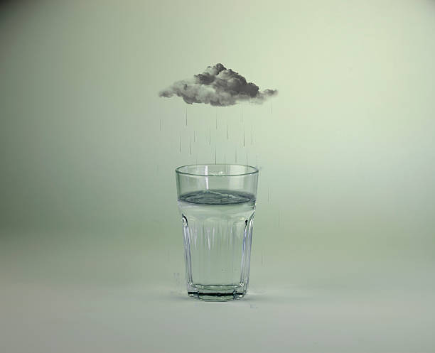 Raincloud over glass of water photo manipulation